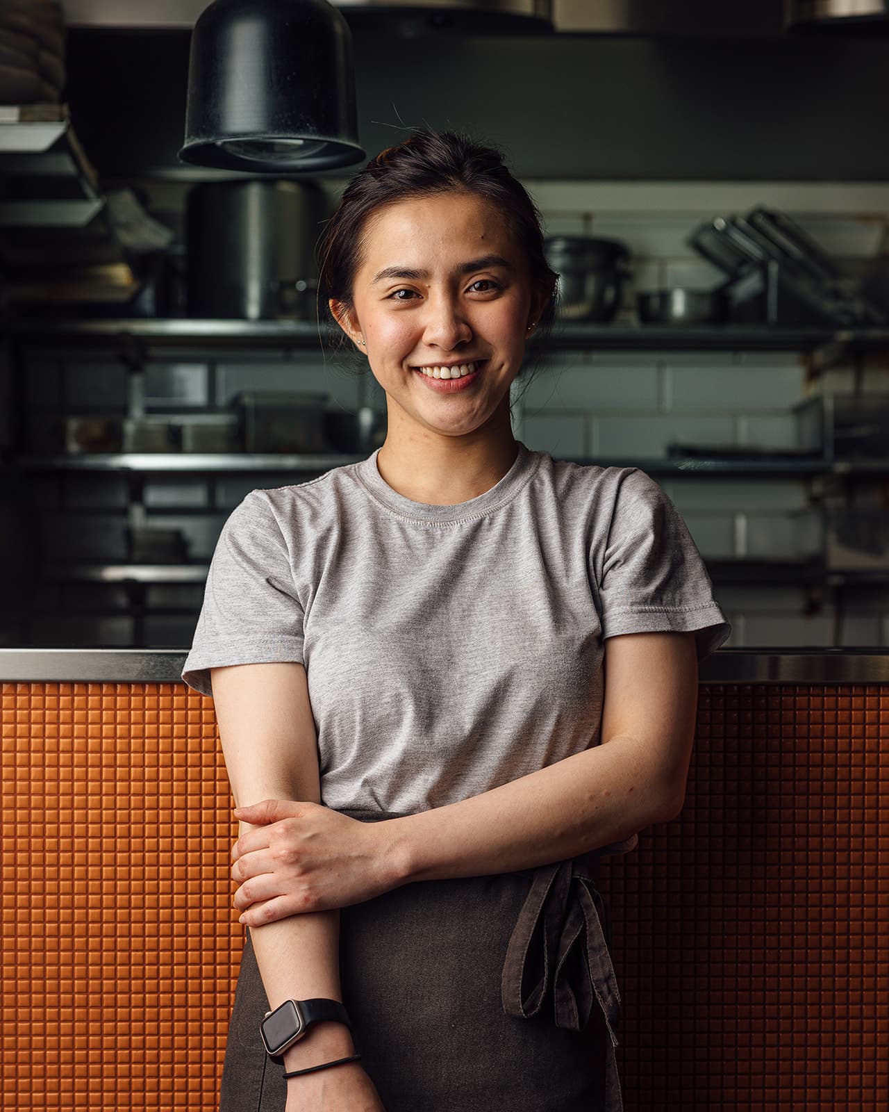 A smiling member of the Pobrecito team