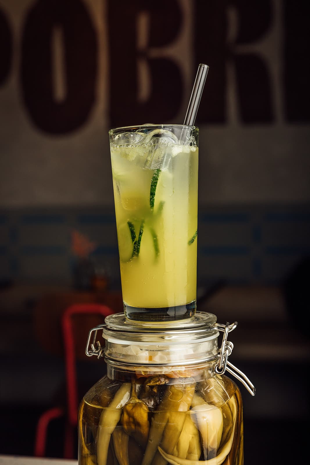 A cucumber cooler in front of the Pobrecito sign